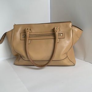 Camel colored leather Coach handbag with tassels